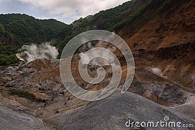 Smoke vents escaping from the earthâ€™s surface in Hell Valley Jigokudani Stock Photo